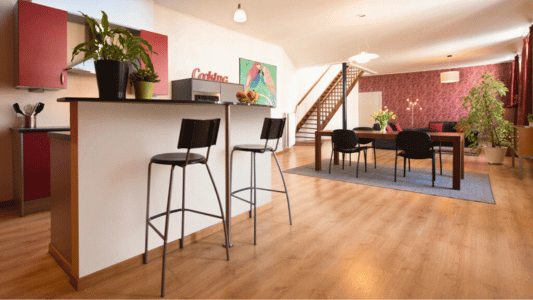 Spacious living room of Carmers in Bruges, featuring air conditioning. Perfect for two persons, part of De Drie Koningen apartments.